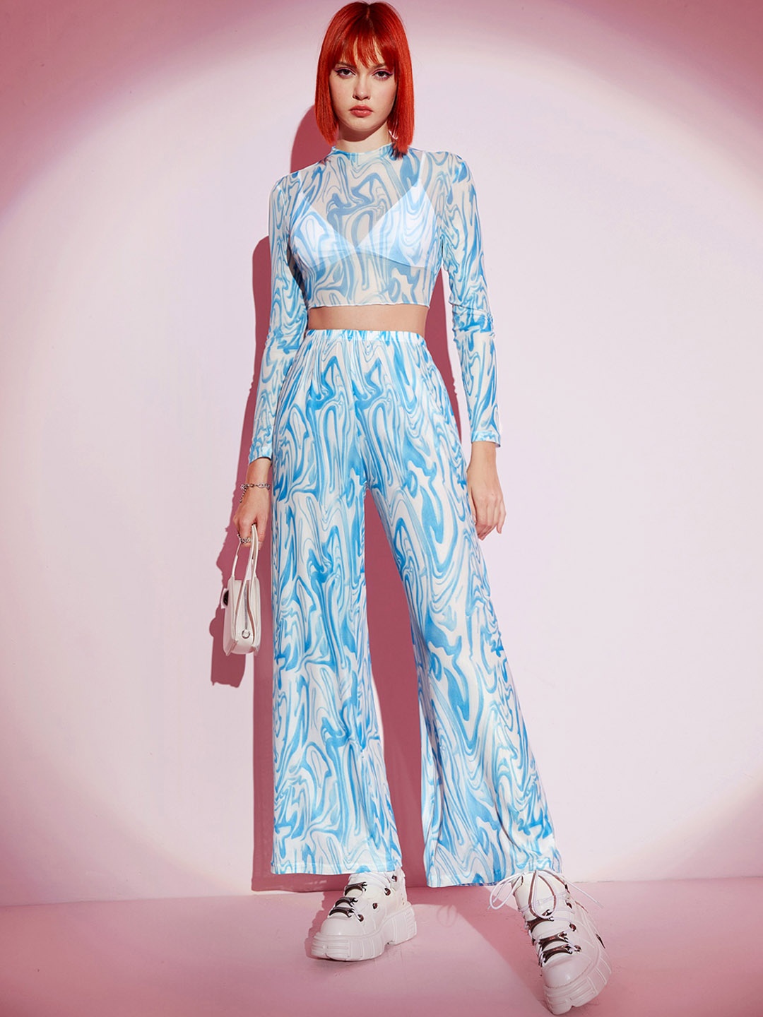 

URBANIC Women White & Blue Printed Crop Top With Flared Trousers