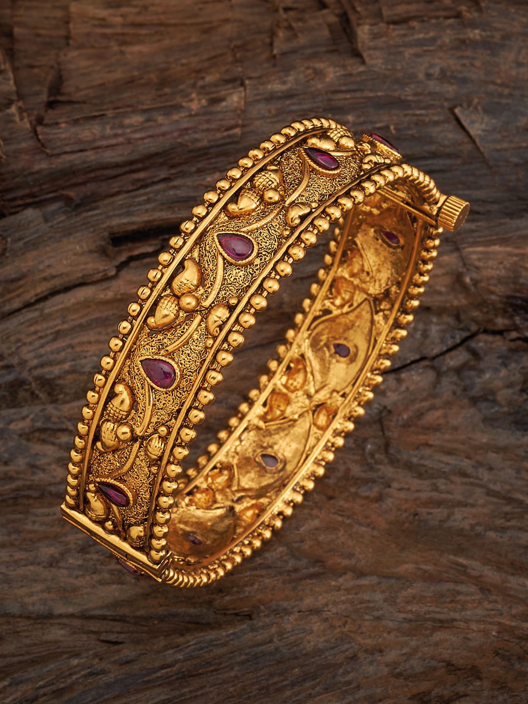 

Kushal's Fashion Jewellery Gold-Plated Red Stone-Studded Antique Bangle