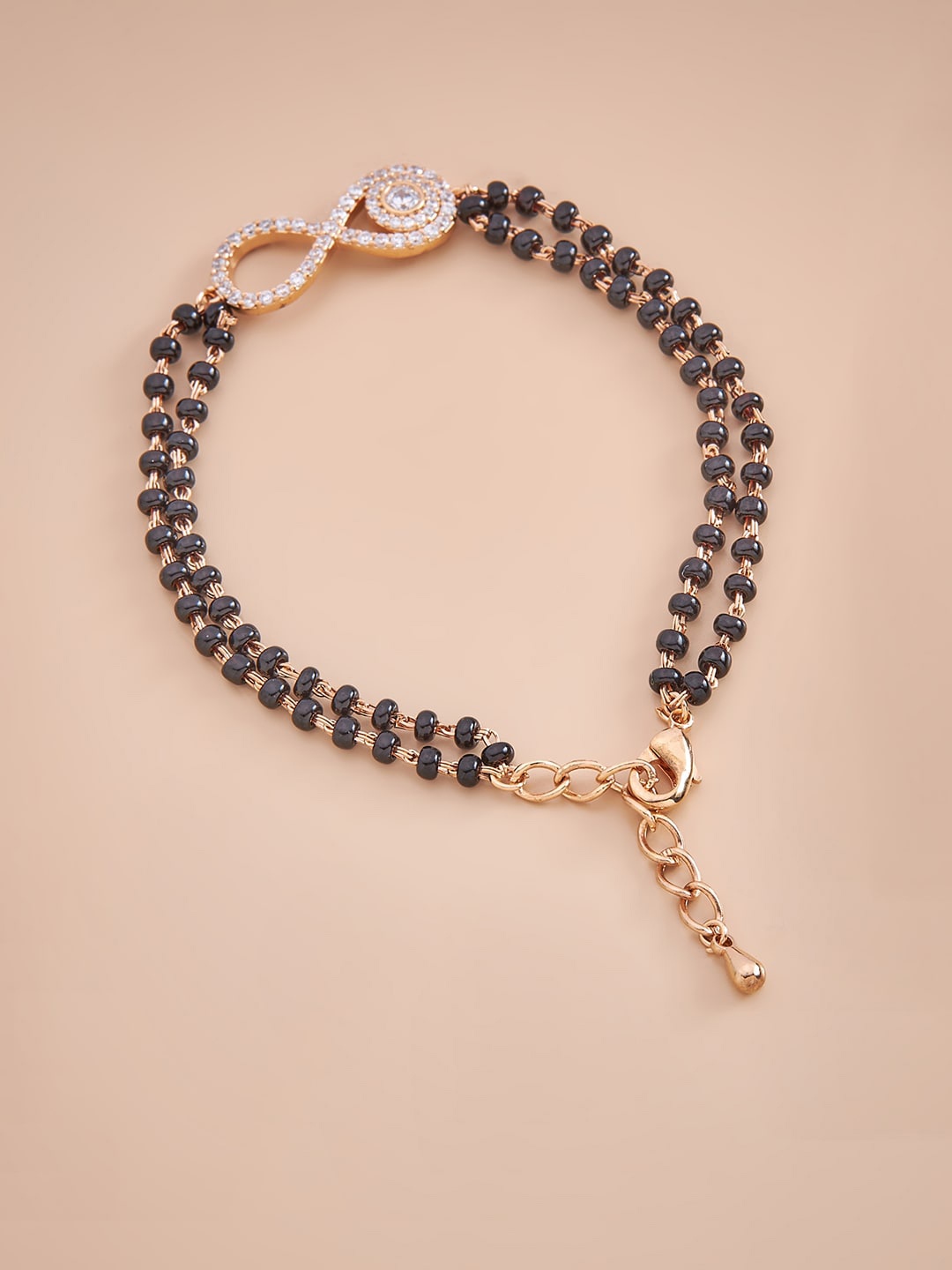 

Kushal's Fashion Jewellery Women Gold-Plated Black & White Cubic Zirconia Charm Bracelet