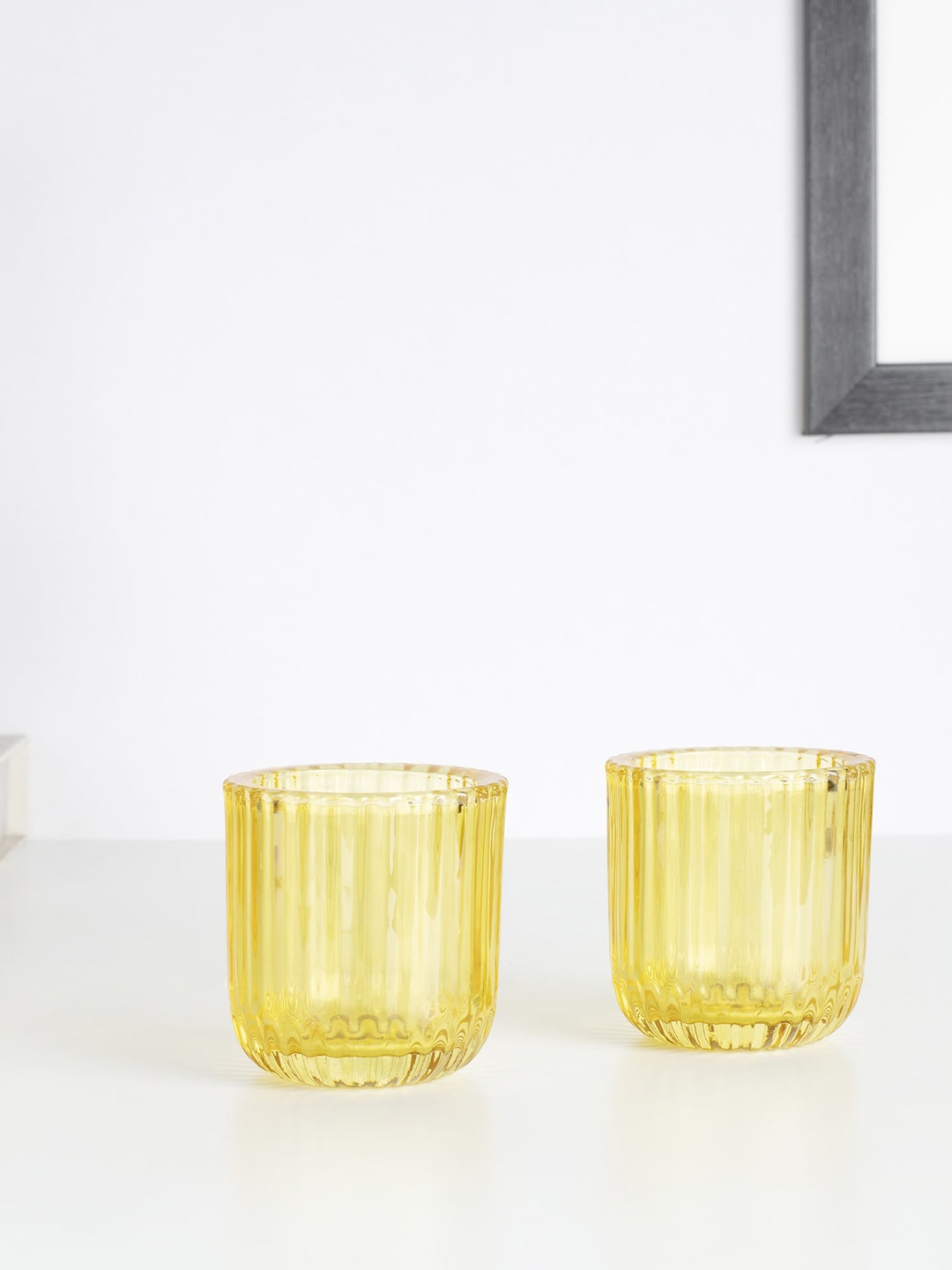 

HomeTown Set Of 2 Yellow Textured Candle Holders