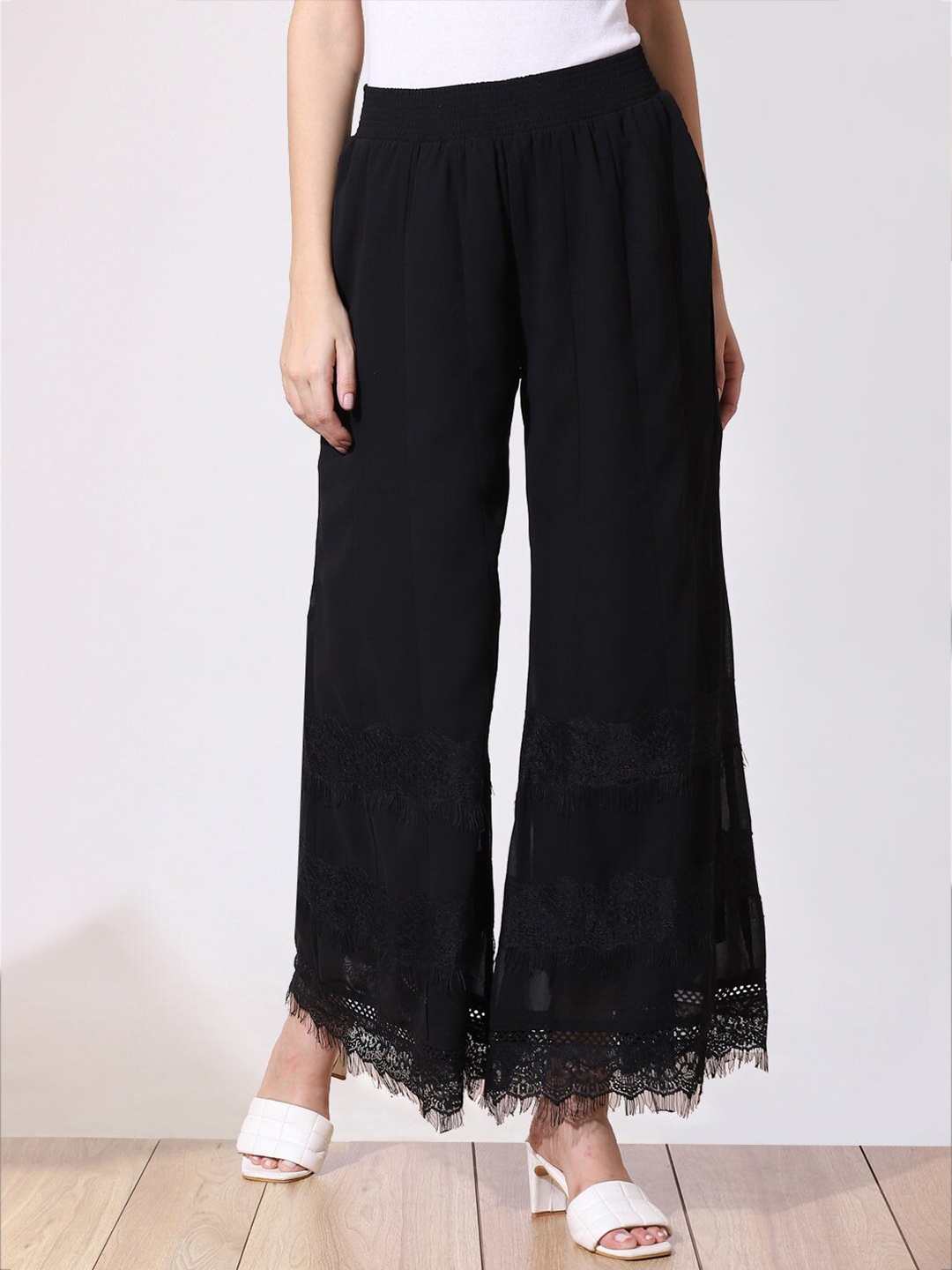

Lakshita Women Black Embroidered Flared Palazzos