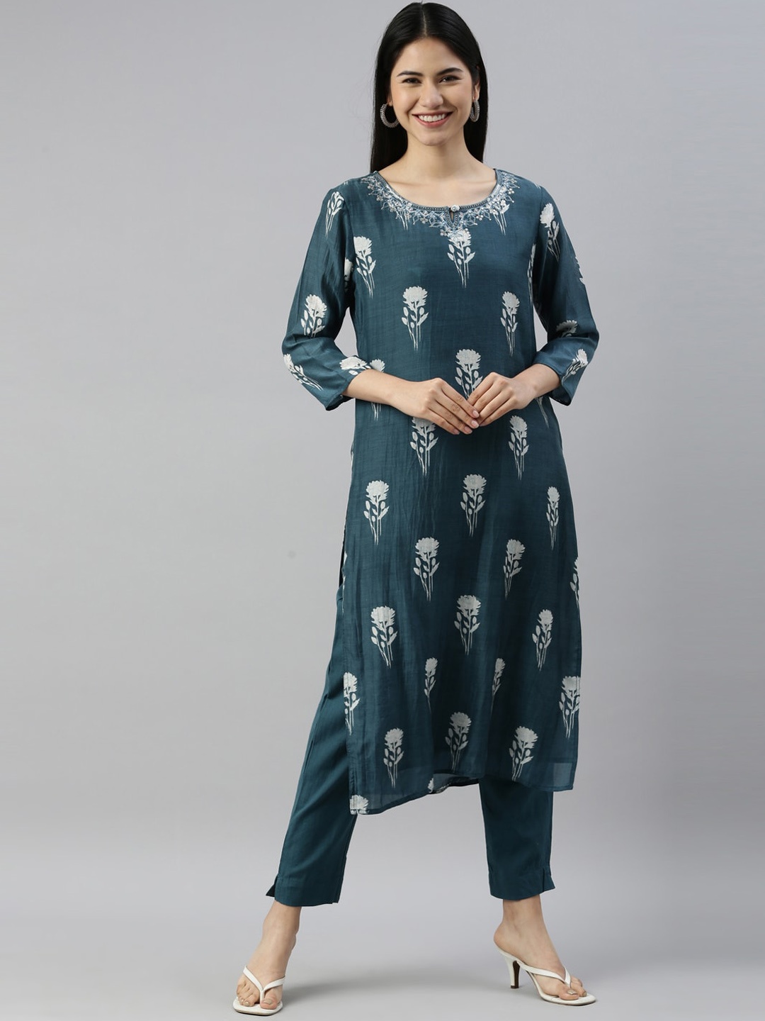 

Neerus Women Blue Floral Embroidered Panelled Thread Work Kurti with Trousers