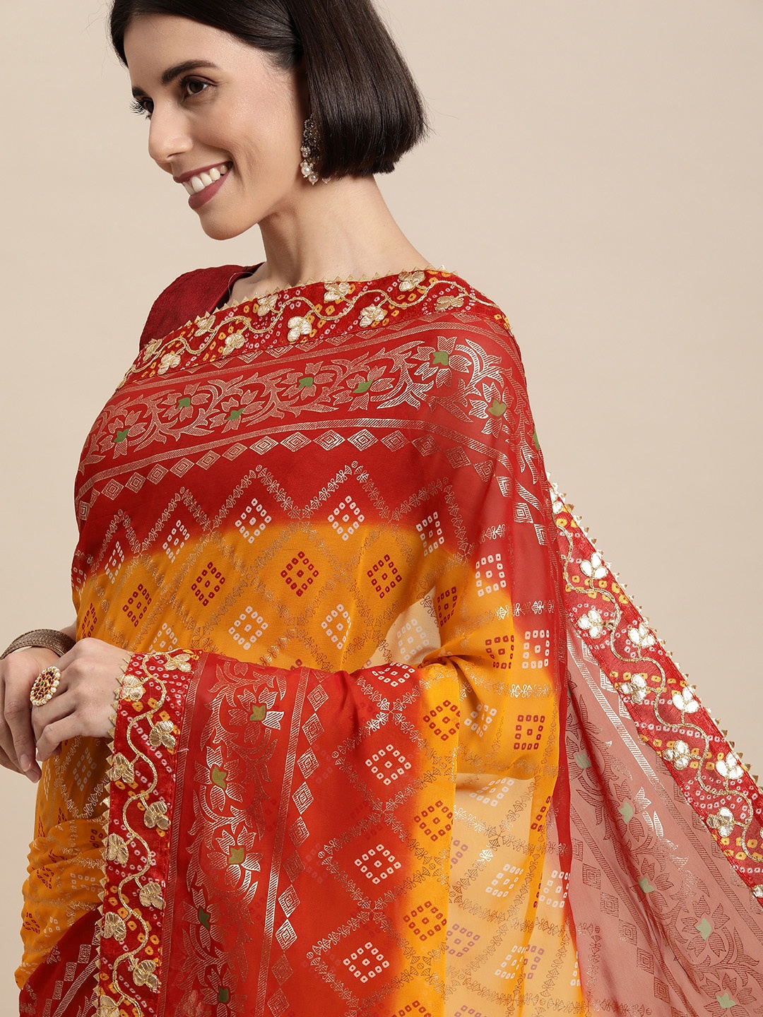 

Mitera Yellow & Red Bandhani Gotta Patti Pure Georgette Bandhani Saree