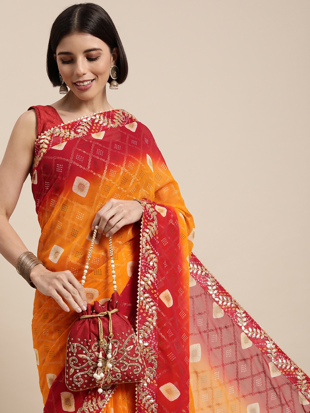 

Mitera Yellow & Red Bandhani Gotta Patti Pure Georgette Bandhani Saree