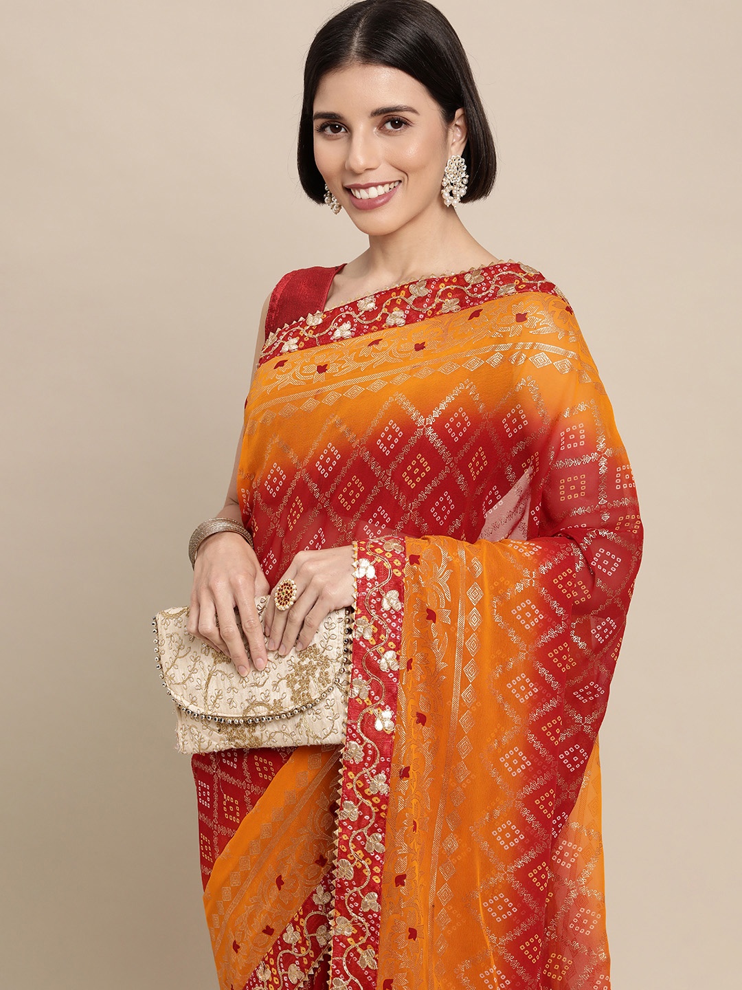 

Mitera Red & Yellow Bandhani Gotta Patti Pure Georgette Bandhani Saree