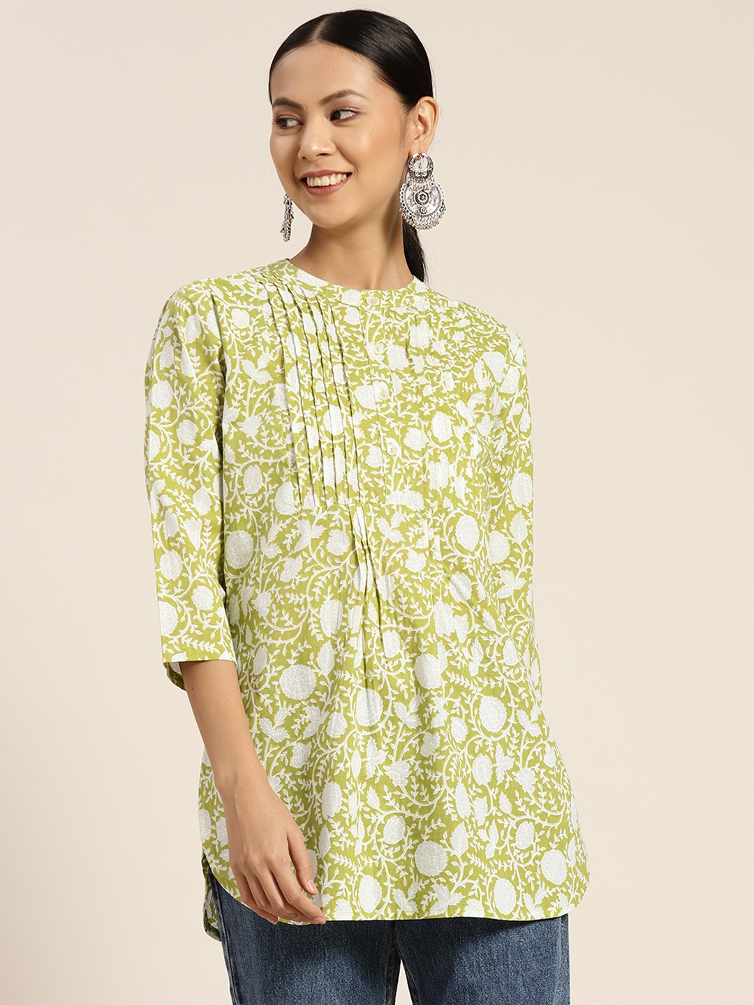 

Rain & Rainbow Green & White Ethnic Motifs Printed Pure Cotton Pleated Kurti