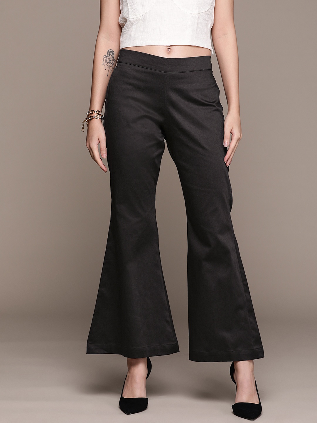 

aarke Ritu Kumar Women Black Solid Wide Trousers