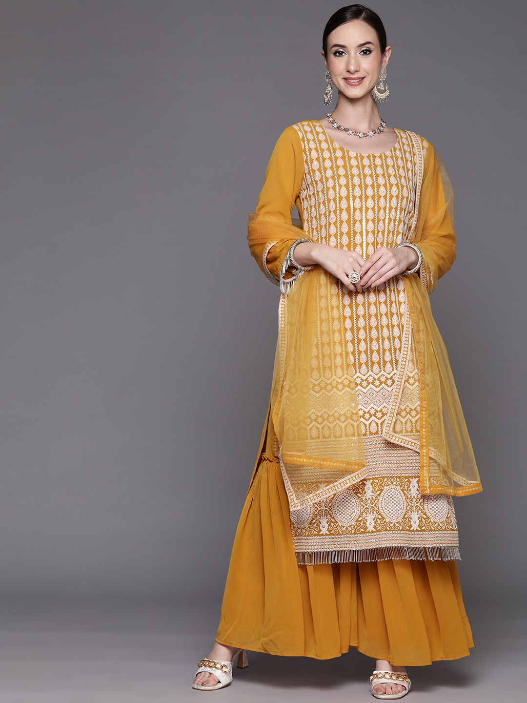 

Indo Era Women Mustard Yellow Floral Embroidered Thread Work Kurta with Sharara & With Dupatta