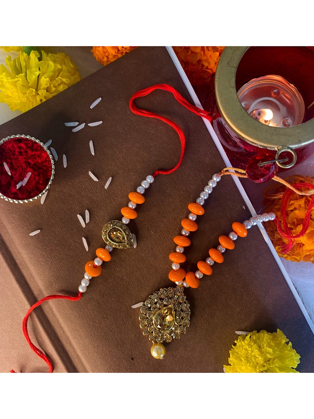 

I Jewels Set of 2 Orange Pearls Studded Lumba Rakhi