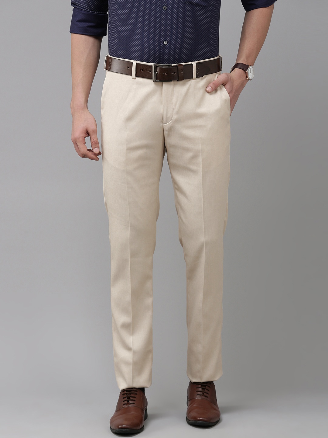 

Arrow Men Beige Solid Tailored Formal Trousers