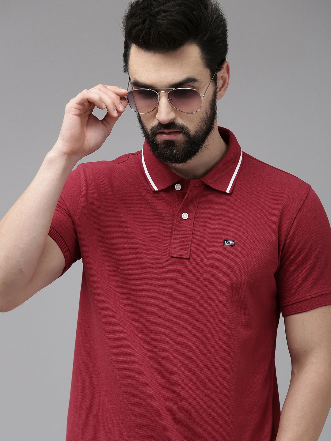 

Arrow Men Red Solid Polo Collar T-shirt
