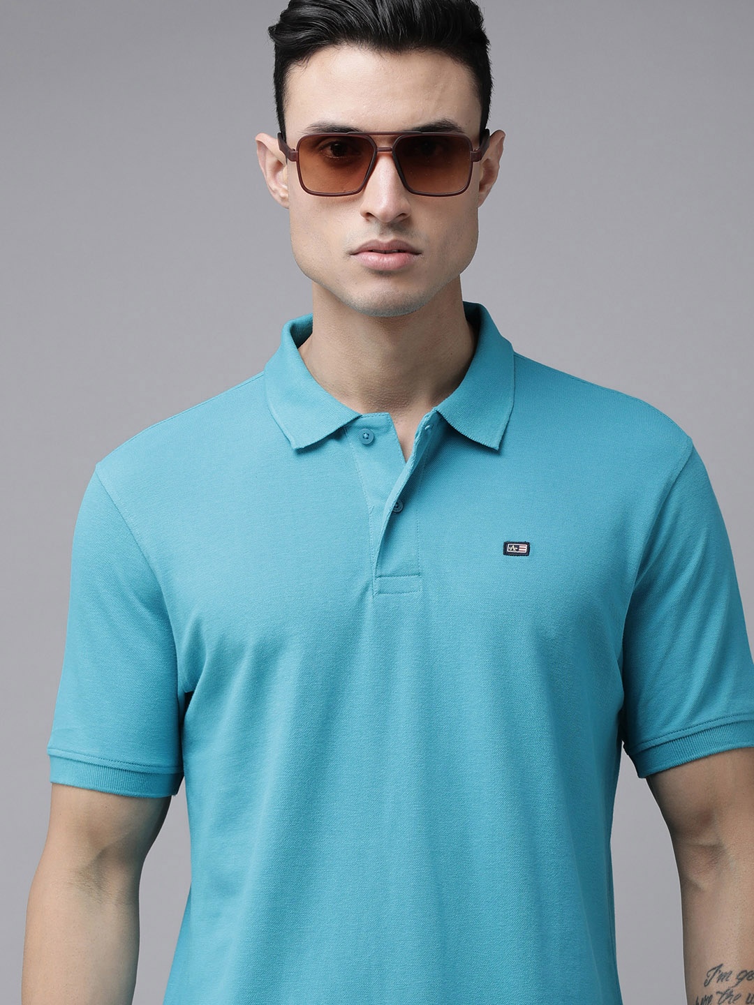 

Arrow Sport Men Turquoise Blue Solid Ribbed Polo Collar T-shirt
