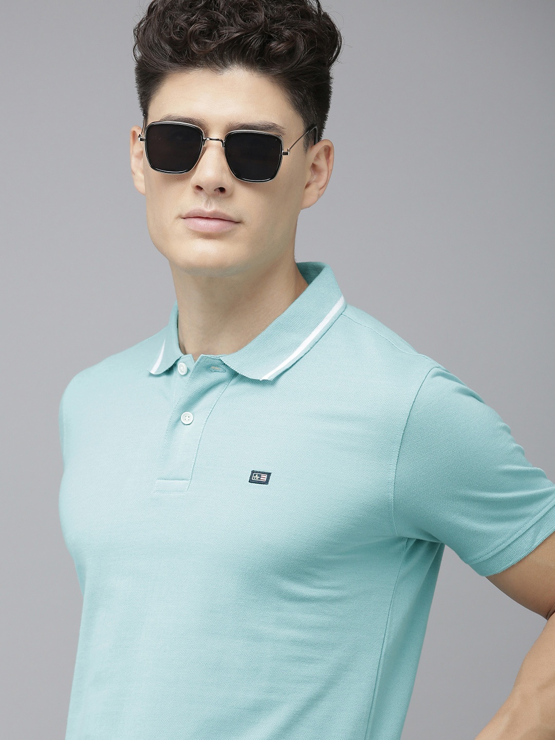 

Arrow Men Turquoise Blue Polo Collar T-shirt