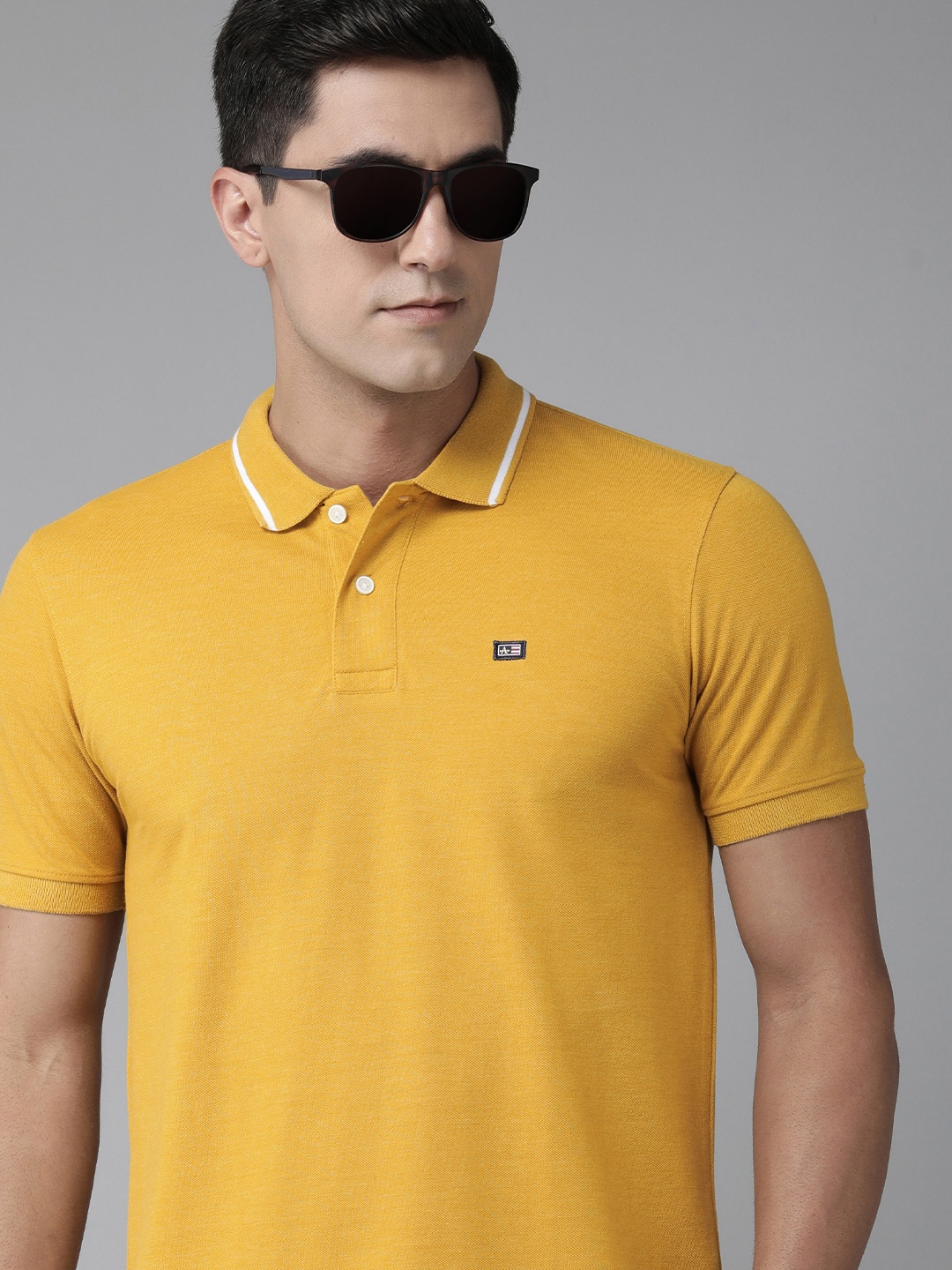 

Arrow Men Solid Polo Collar T-shirt, Yellow