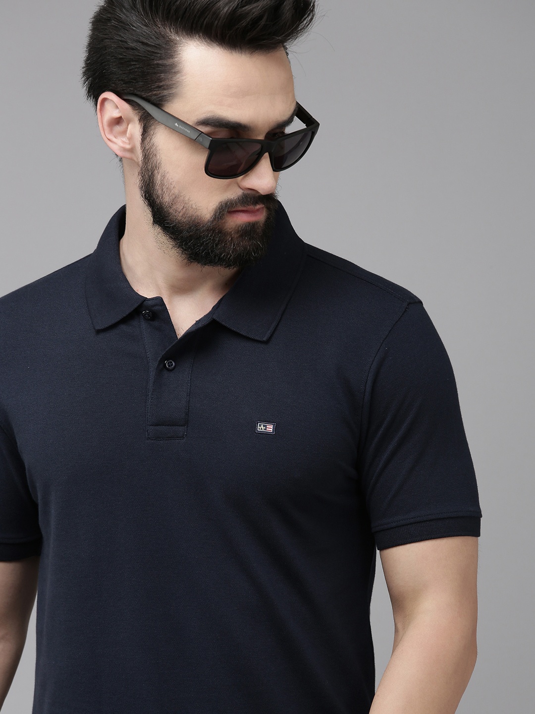 

Arrow Men Navy Blue Solid Polo Collar T-shirt