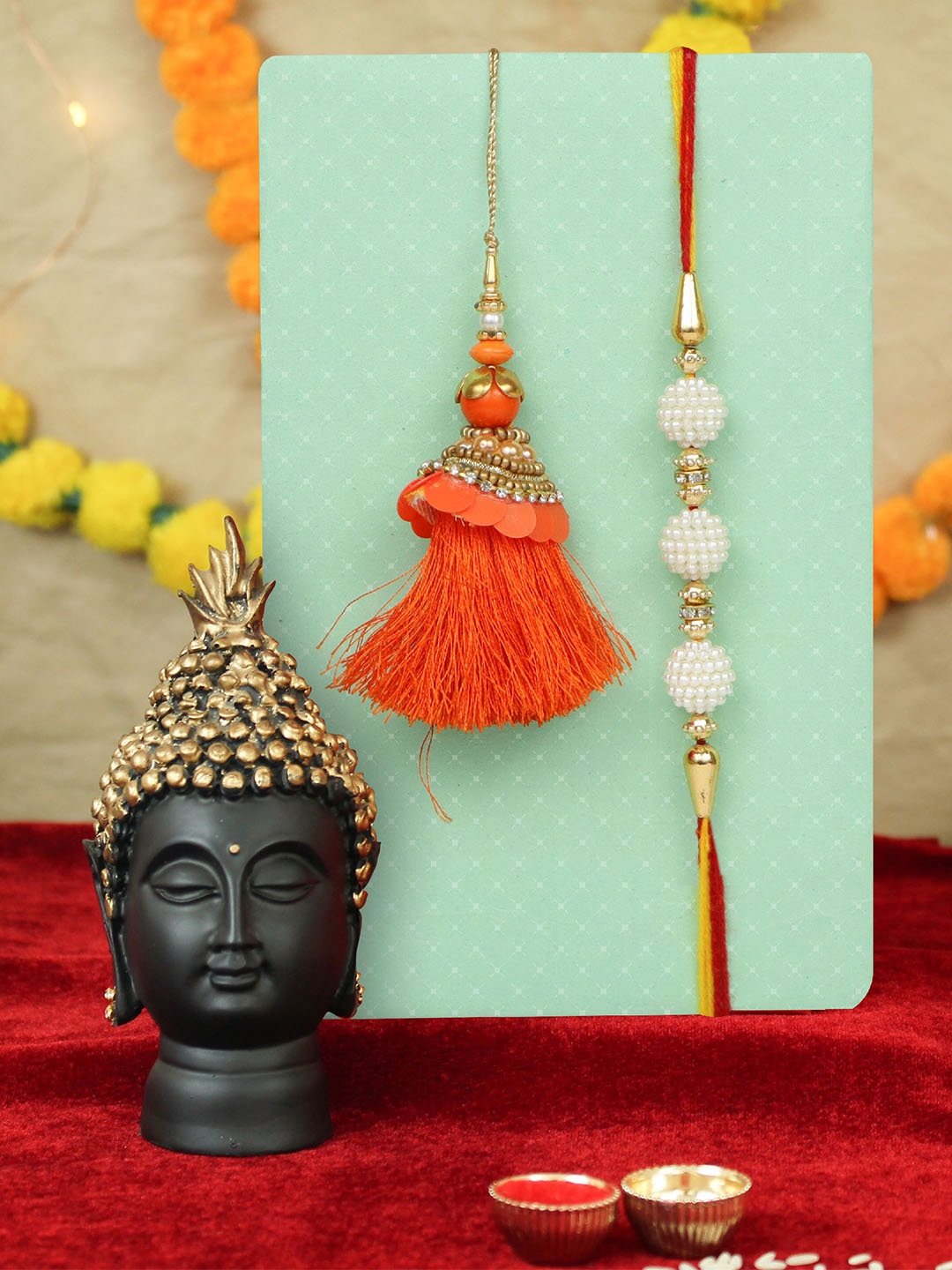 

TIED RIBBONS Set of 2 Peacock Rakhi with Lord Buddha Idol Gift Set, Pink