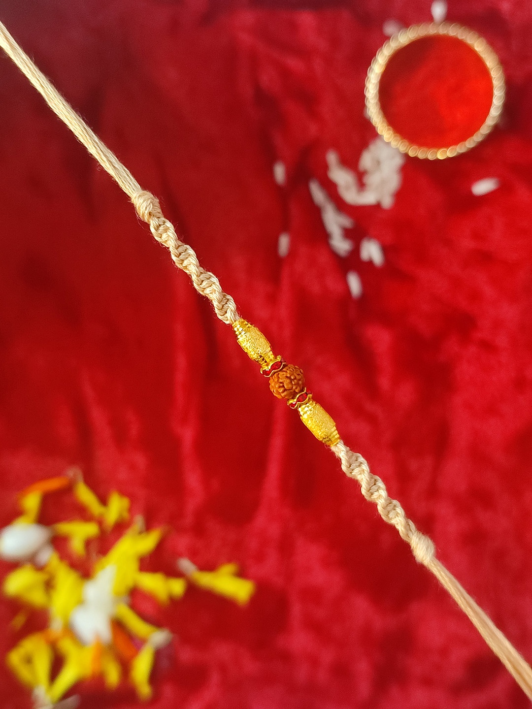

Crayton Men Beige & Gold-Toned Rudraksh Beaded Rakhi