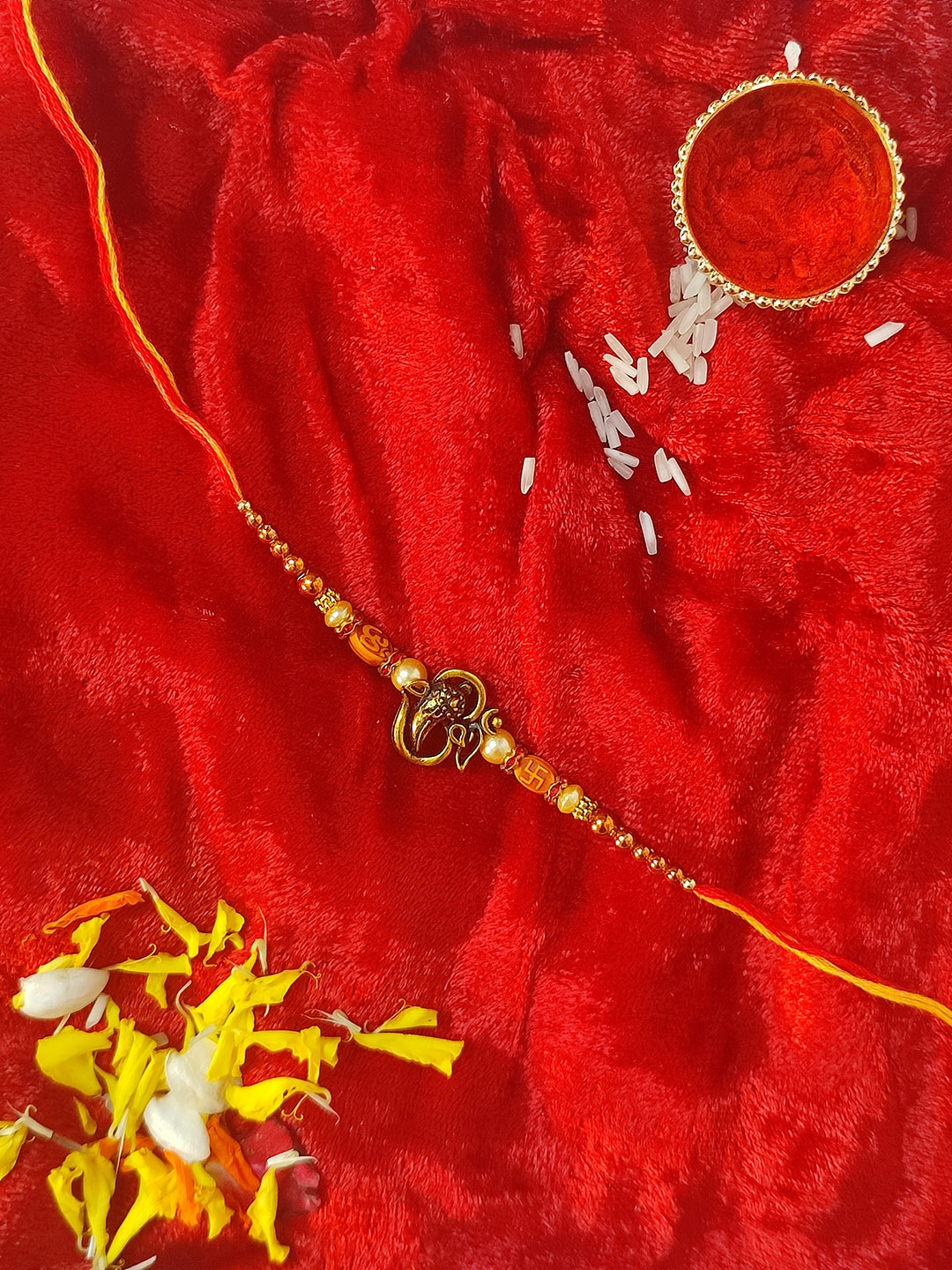

CRAYTON Gold & Orange Om Ganesh Rakhi With Golden Stud