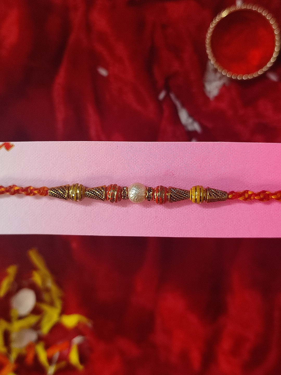 

CRAYTON Men Maroon Gold-Toned & White Pearl Beaded Rakhi