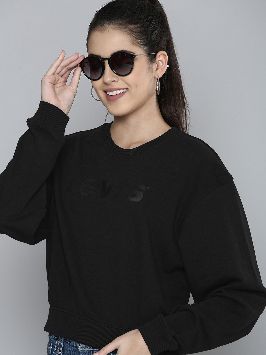 

Levis Women Black Solid Pullover Sweatshirt