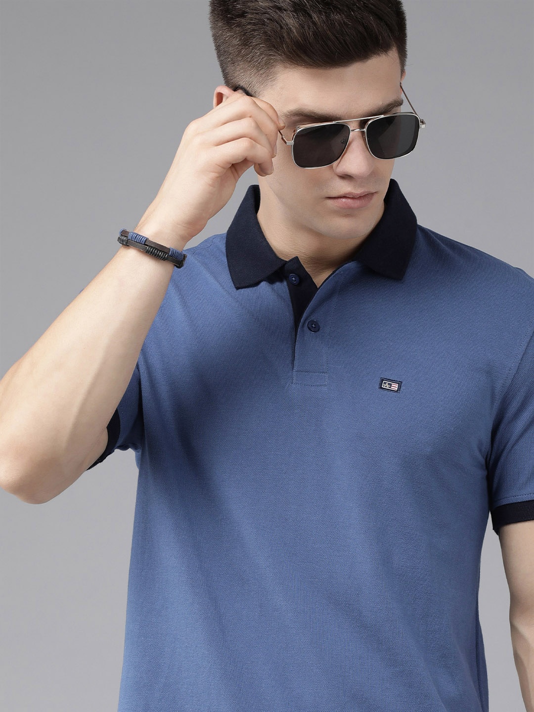 

Arrow Men Blue Solid Polo Collar Embroidered Indigo Pure Compact Cotton Slim Fit T-shirt