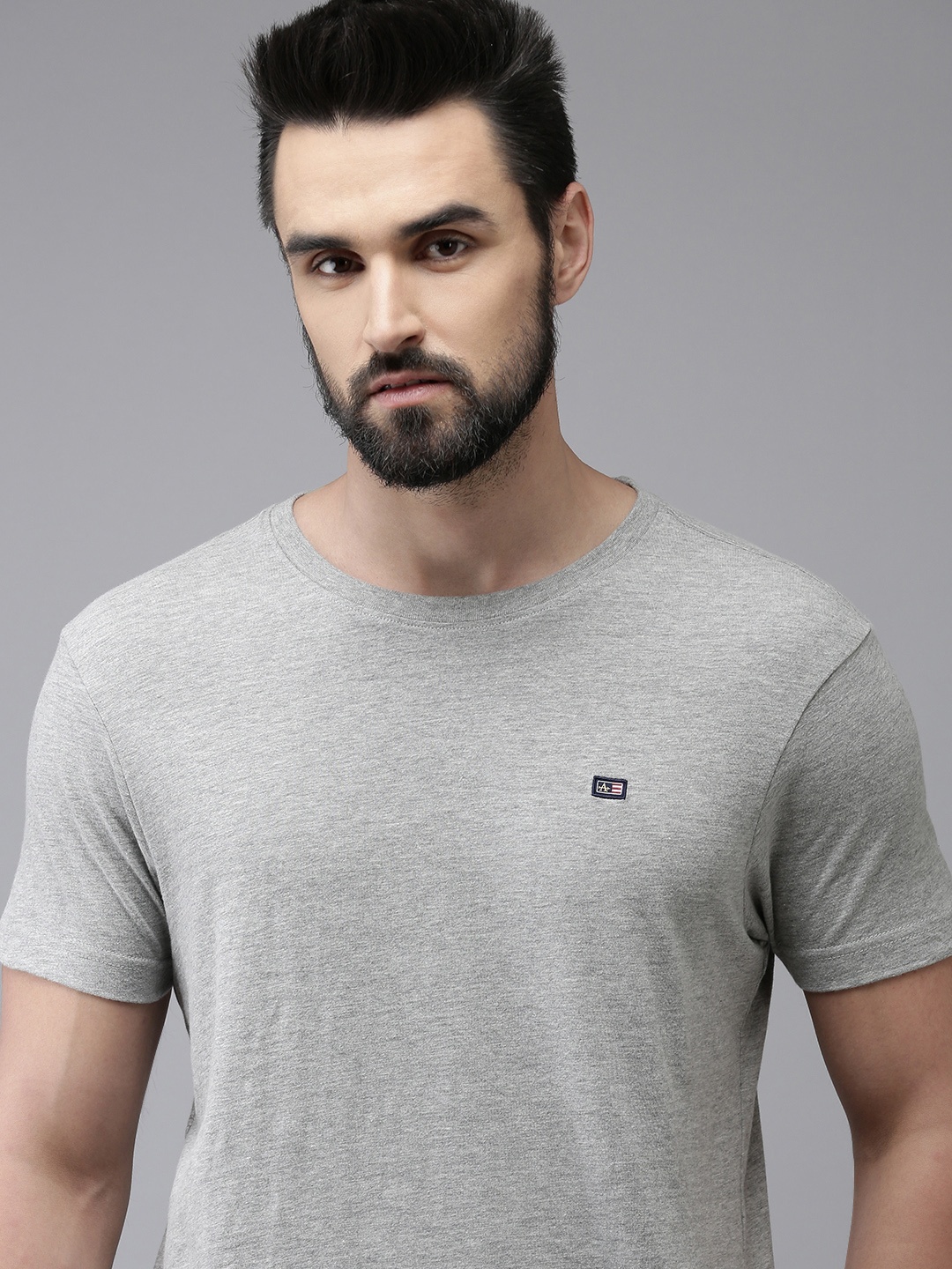 

Arrow Men Grey Melange Solid Round Neck Brand Logo Applique Knitted T-shirt