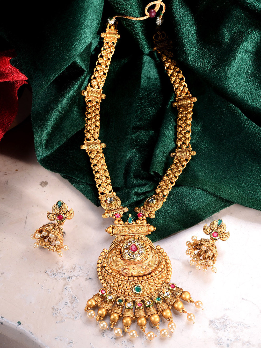 

Saraf RS Jewellery Gold Plated Green & Red Kundan & White Pearl Studded Temple Jewellery Set