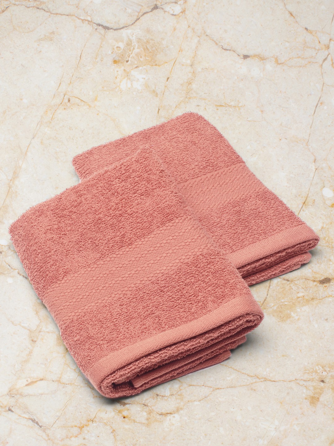 

Monte Carlo Set Of 2 Peach-Colored Solid 525 GSM Cotton Hand Towels