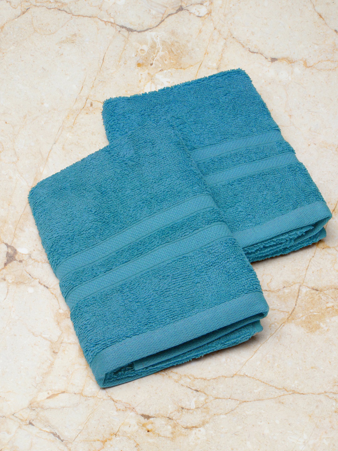 

Monte Carlo Set of 2 Teal Blue 520 GSM Cotton Solid Amber Hand Towel