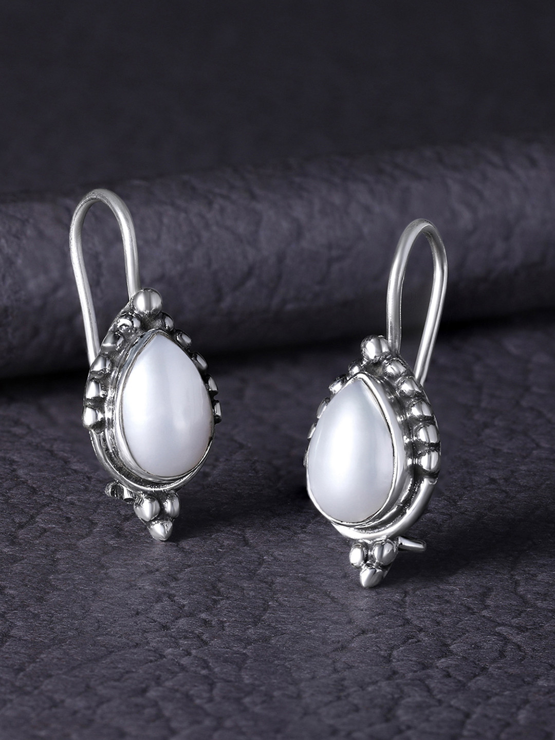 

Silvora by Peora White Teardrop Shaped Studs Earrings