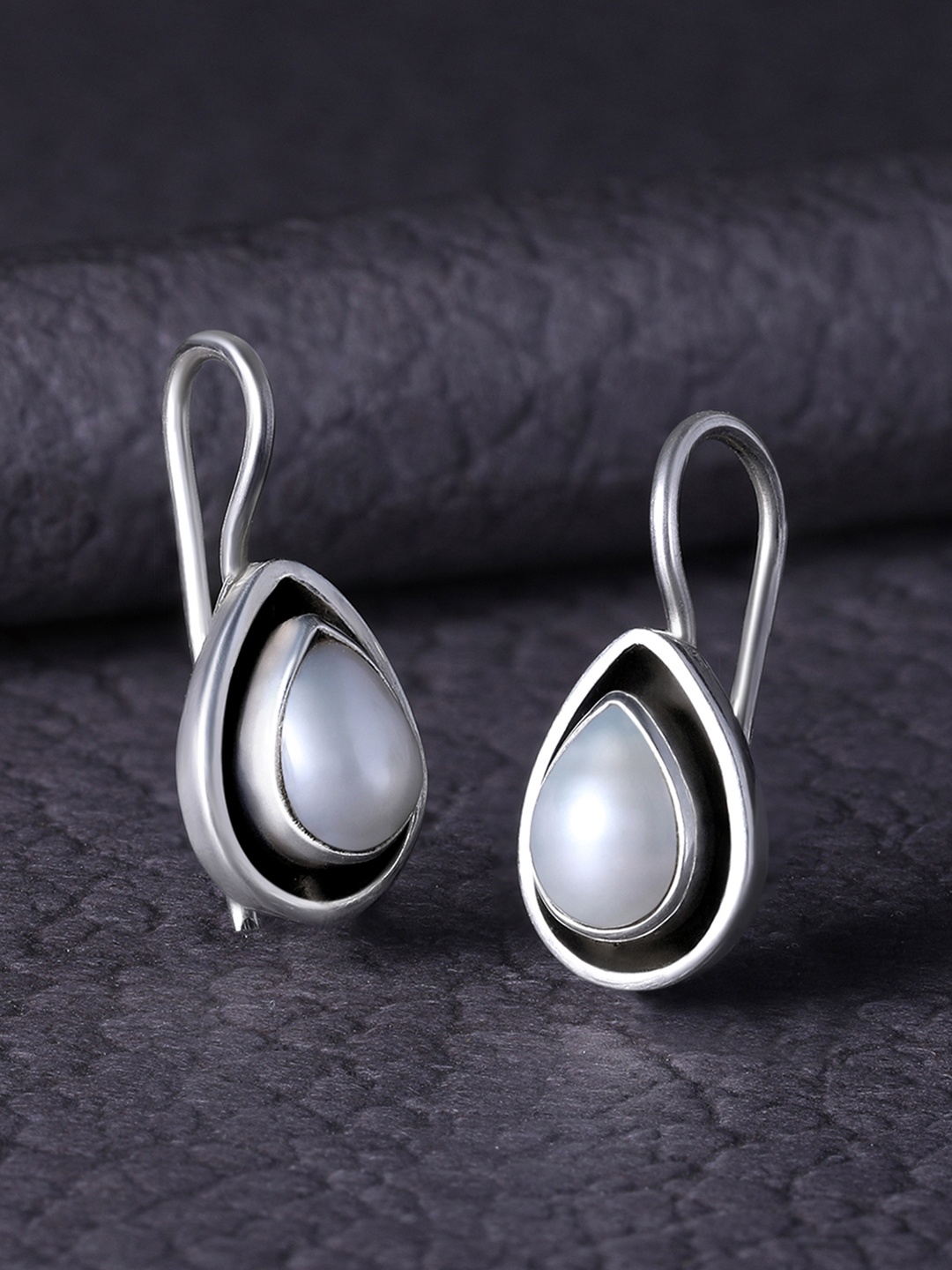 

Silvora by Peora Silver-Toned & White Teardrop Shaped Studs Earrings