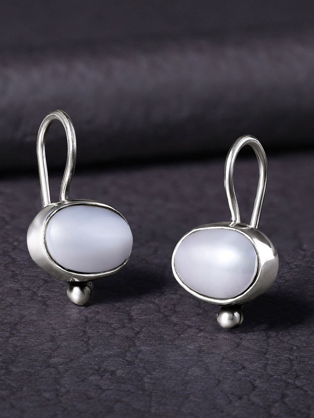 

Silvora by Peora Silver-Toned & White Oval Studs Earrings