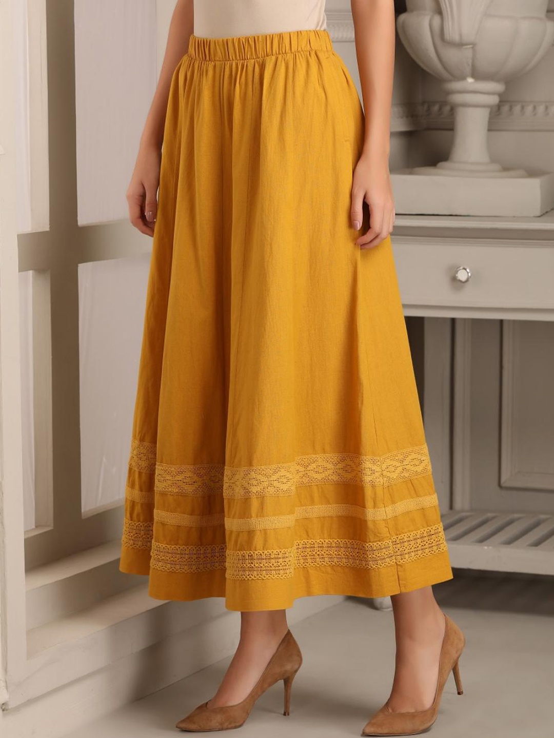 

Lakshita Women Yellow Cotton Blend Solid A- Line Maxi Flared Skirts