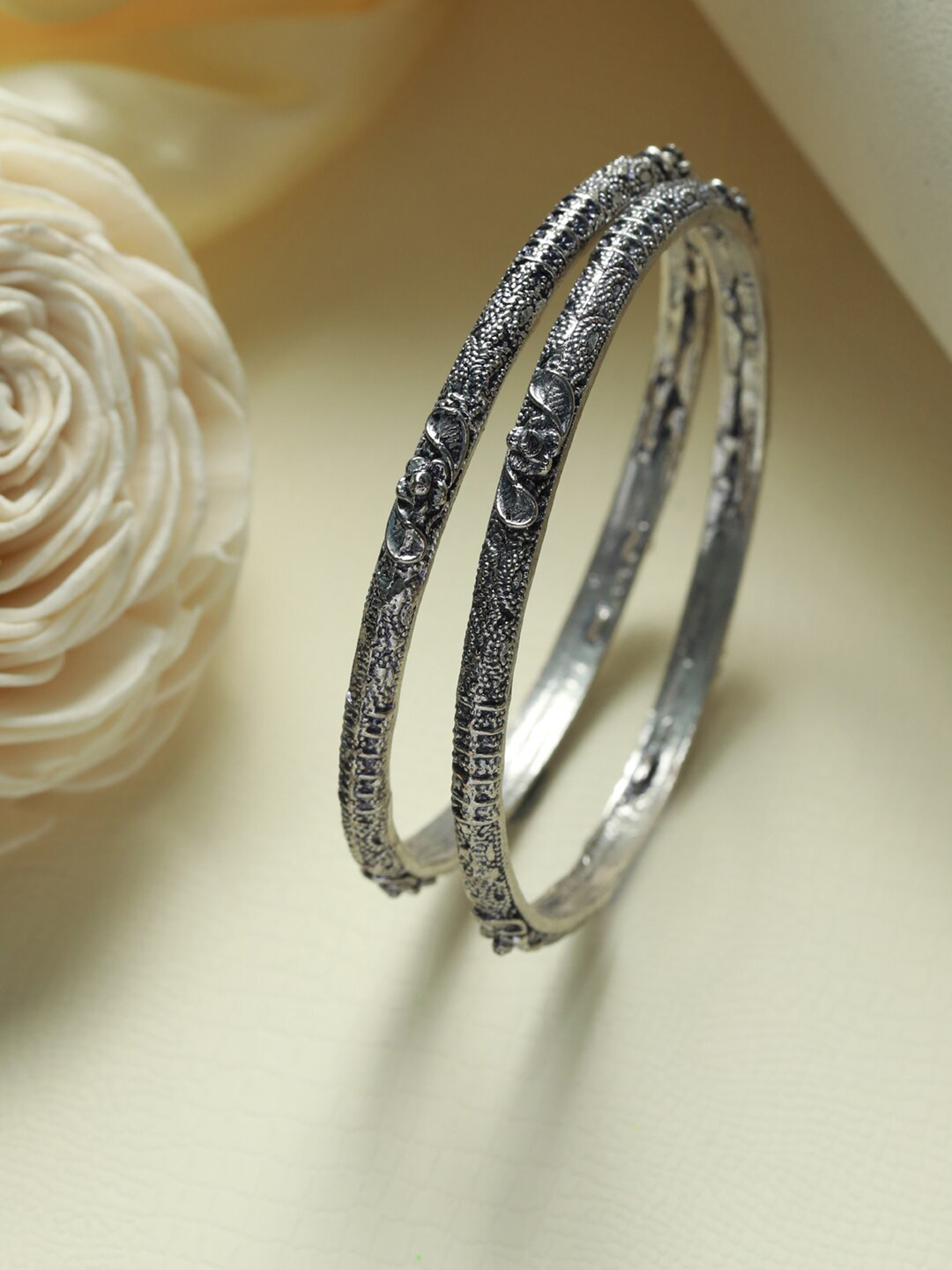 

Priyaasi Set Of 2 Silver-Plated Floral Pattern Oxidised Bangles