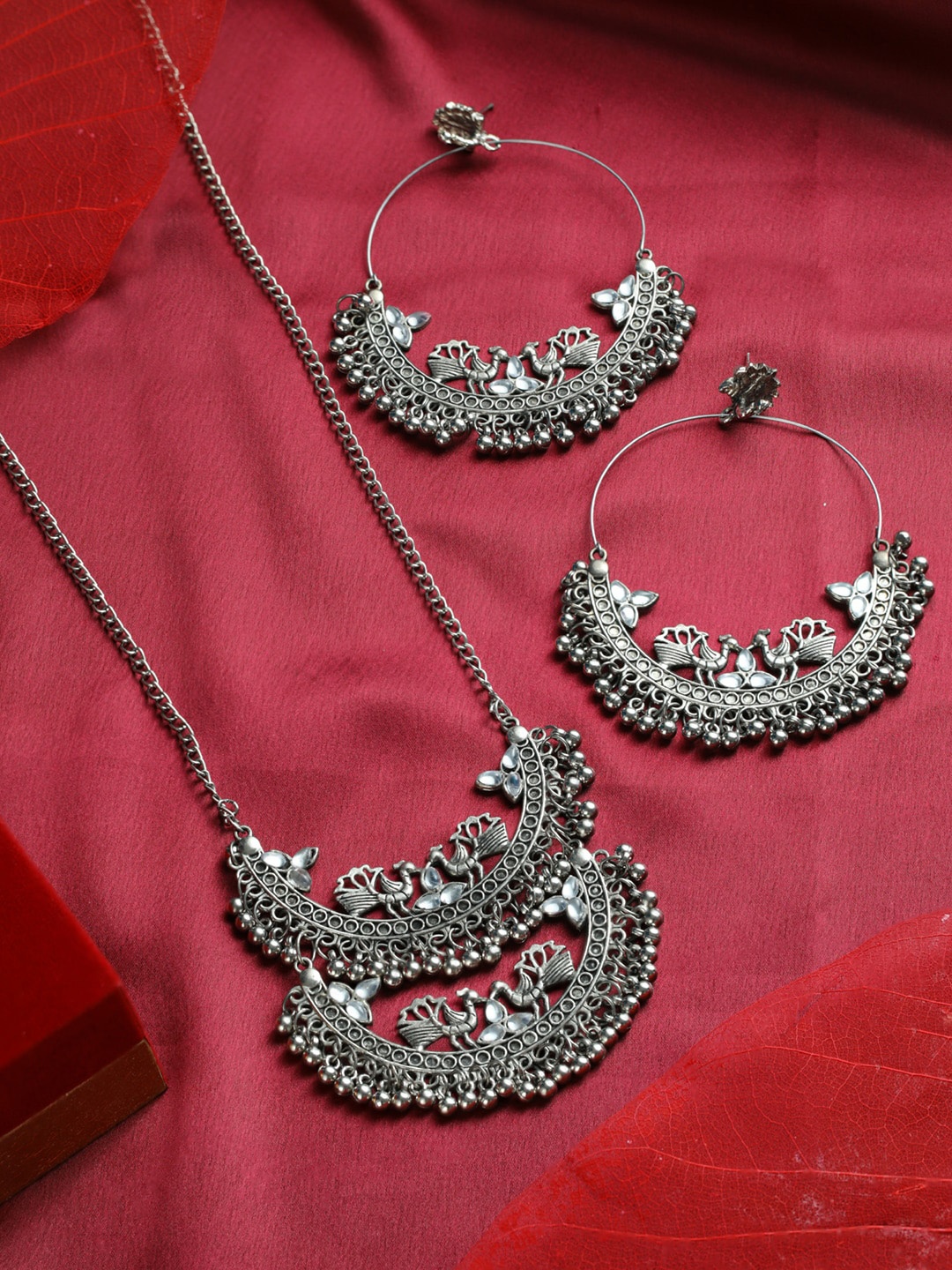 

Priyaasi Oxidised Silver Plated Stone-Studded & Beaded Round Peacock Jewellery Set
