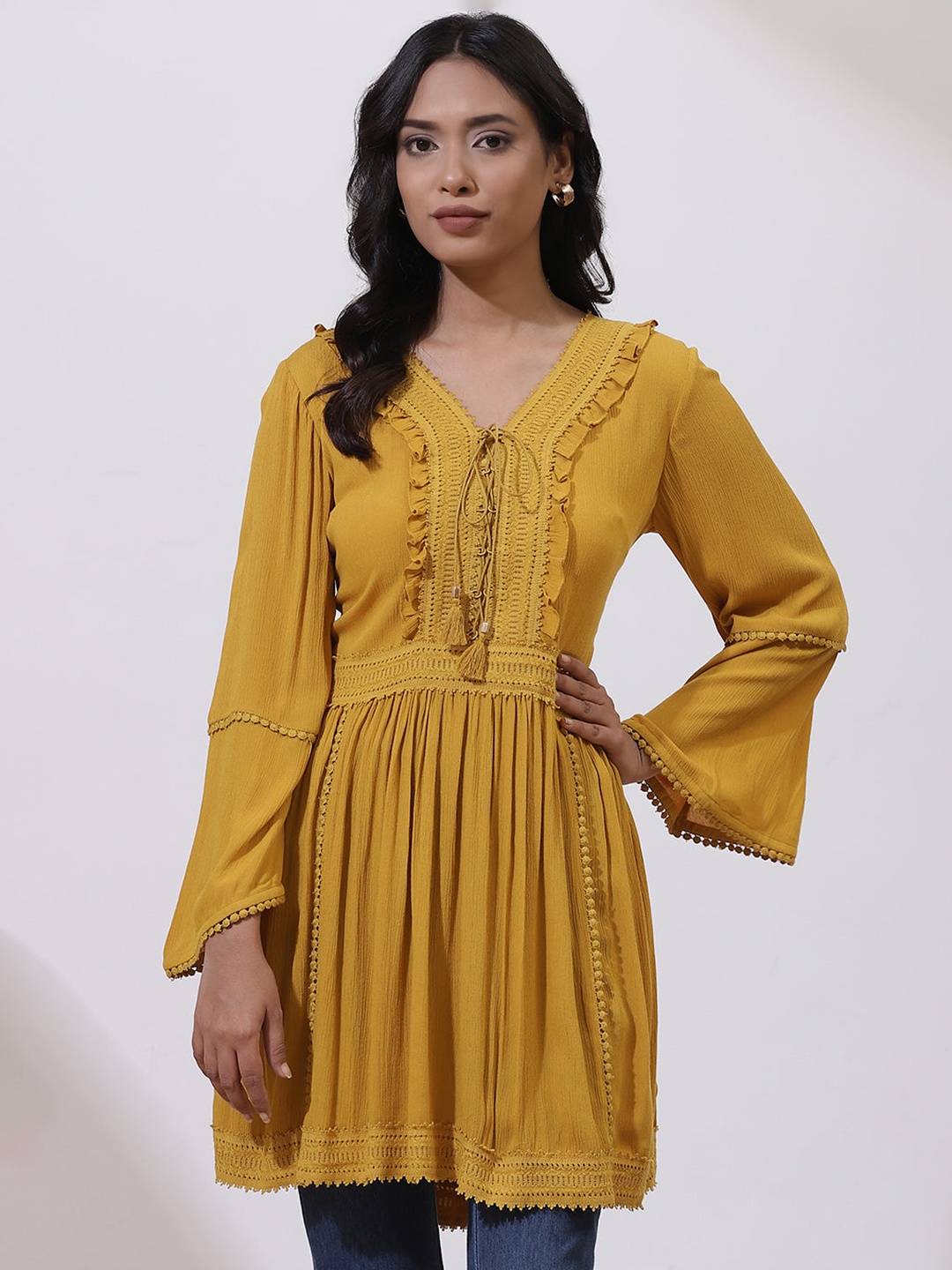 

Lakshita Mustard Yellow Ruffles Empire Longline Top