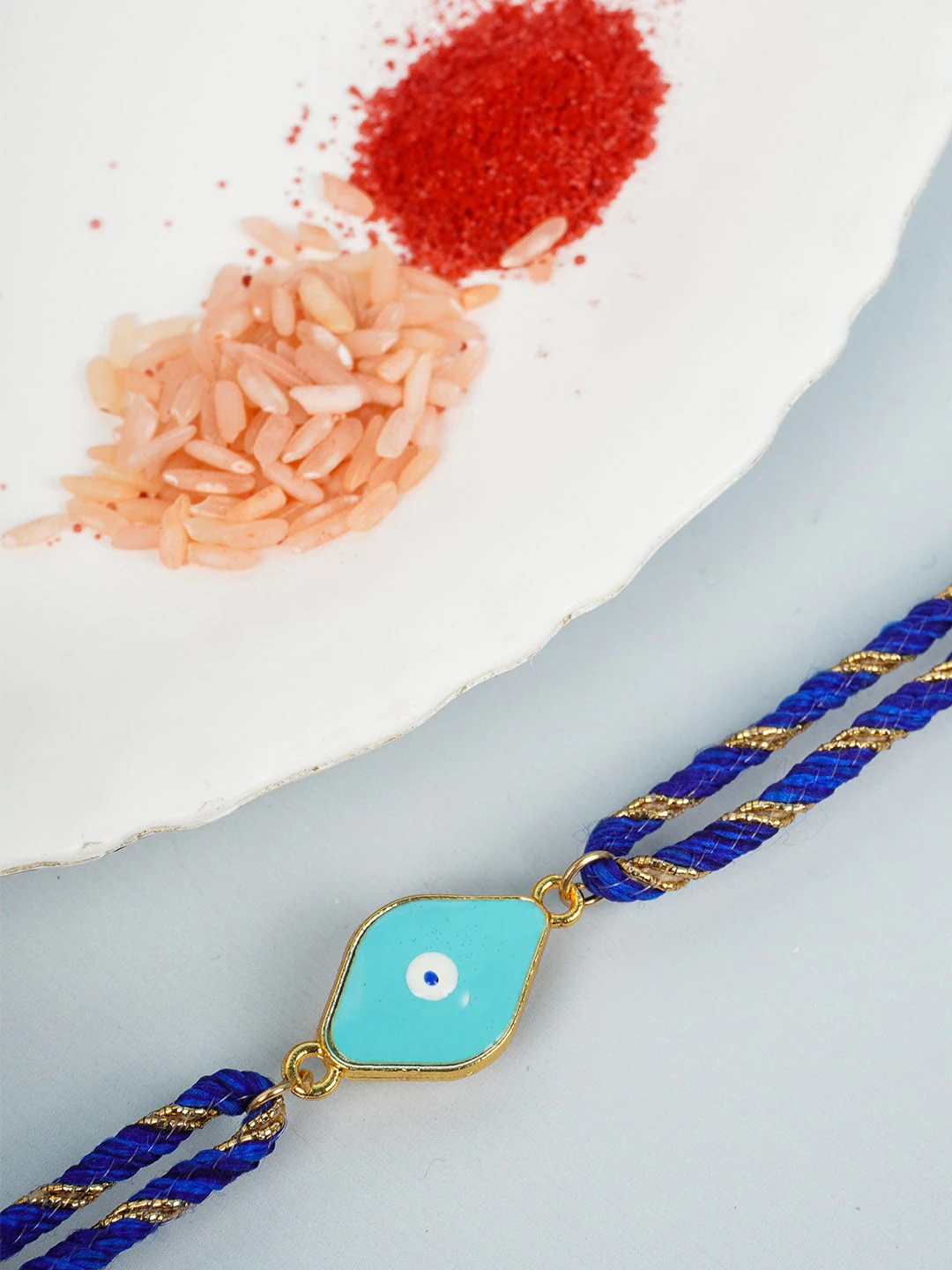 

Ferosh Men Blue Gold-Toned Evil Eye-Charm Rakhi With Roli Chawal