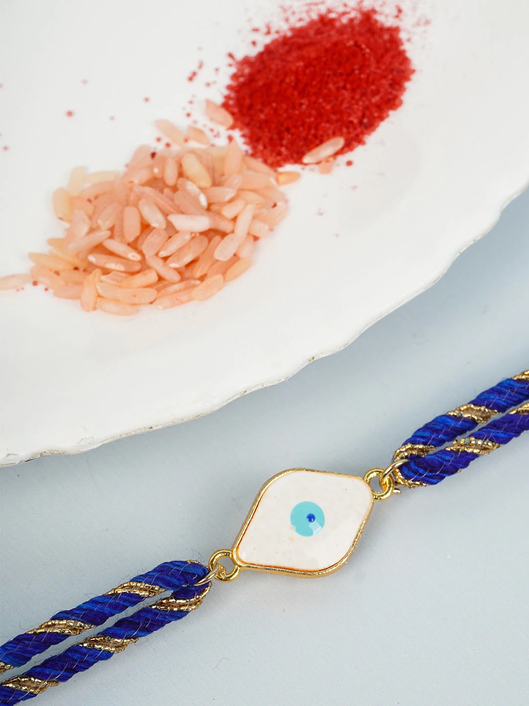 

Ferosh Men White & Blue Evil Eye Rakhi
