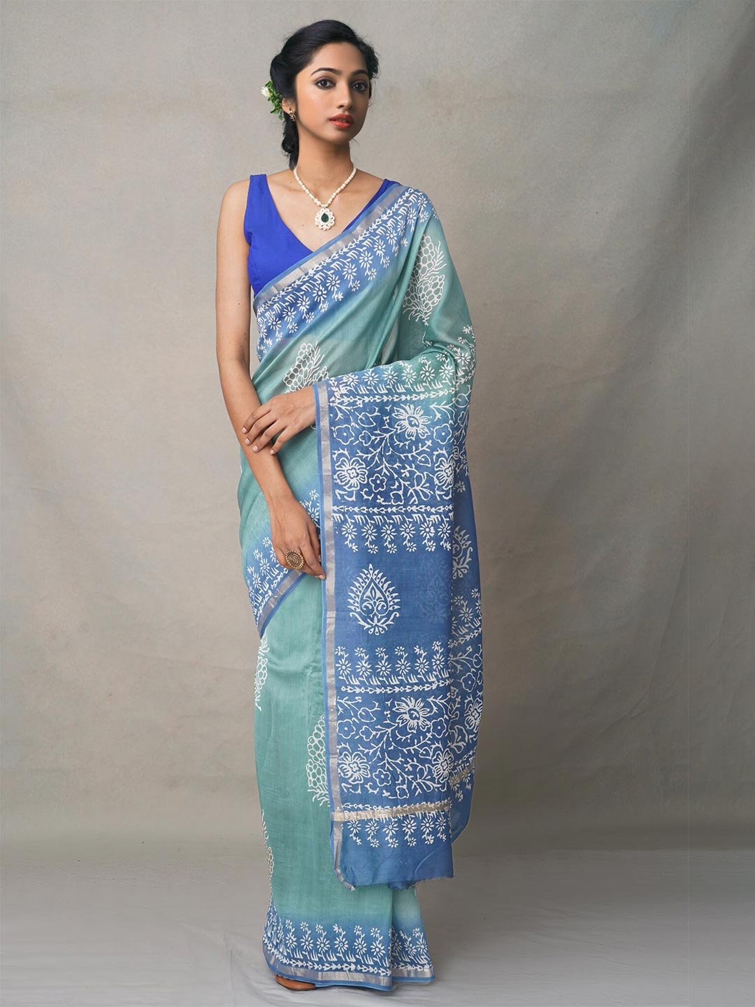 

Unnati Silks Green & Blue Coloured Ethnic Motifs Silk Saree