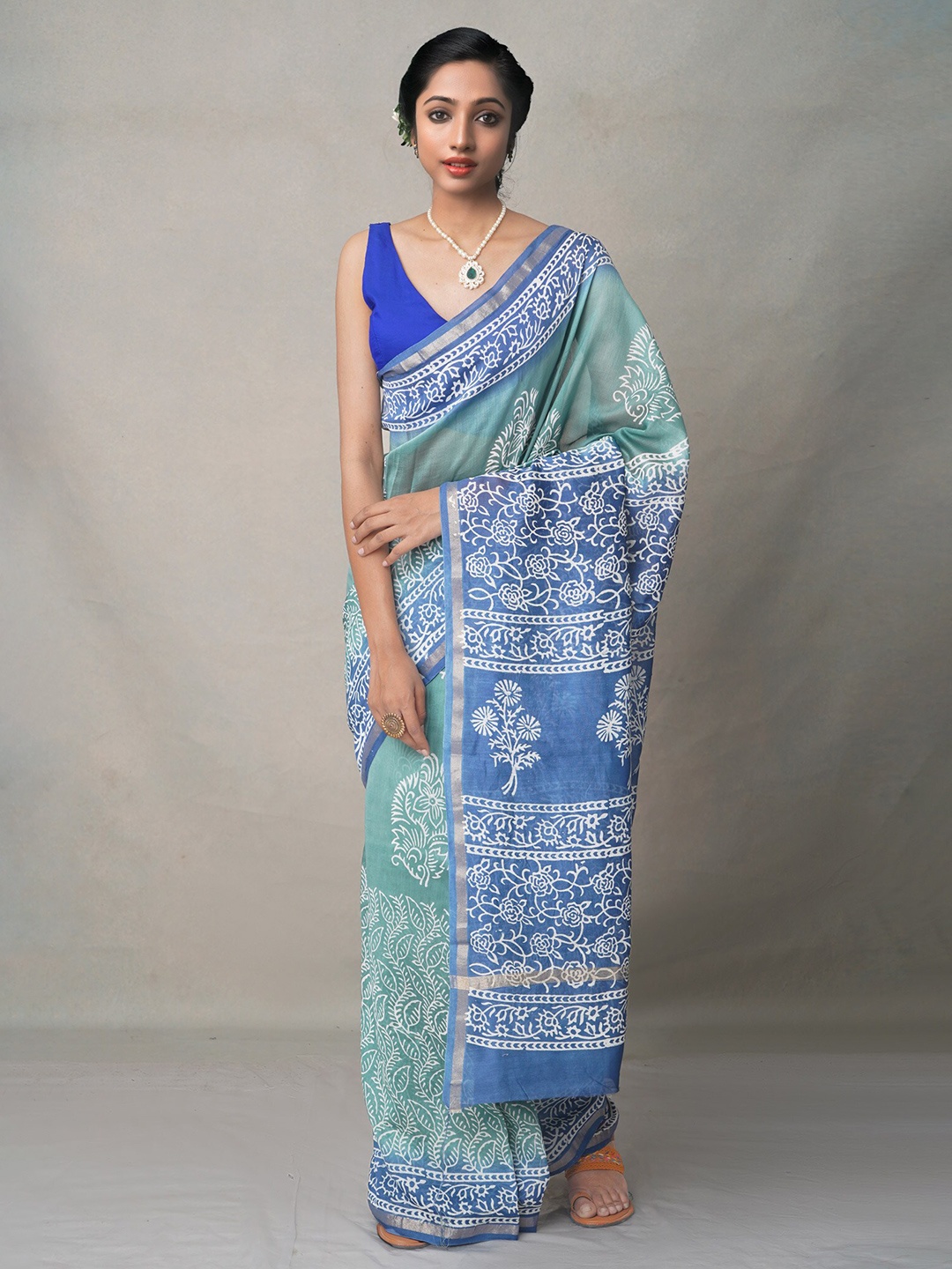 

Unnati Silks Green & Blue Ethnic Motifs Zari Silk Blend Baluchari Saree
