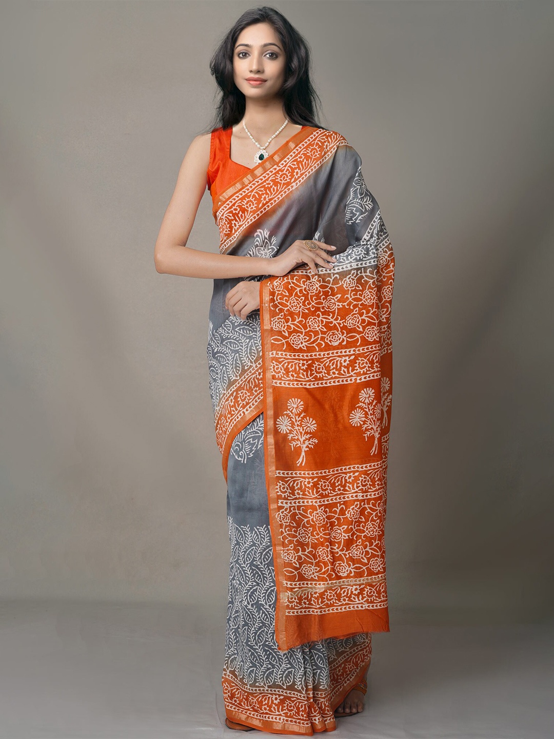 

Unnati Silks Grey & Orange Ethnic Motifs Zari Silk Blend Baluchari Saree