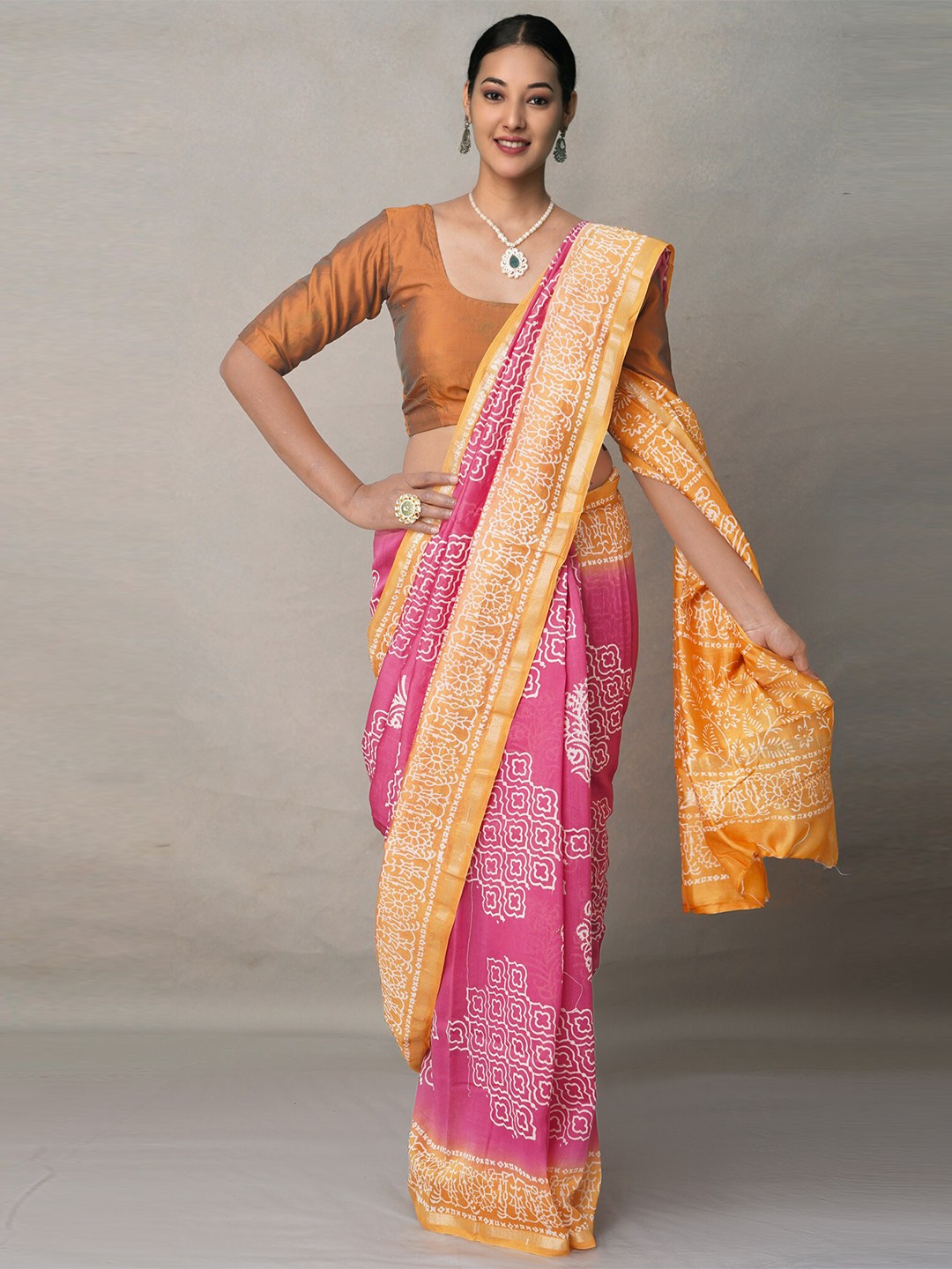 

Unnati Silks Pink & Yellow Ethnic Motifs Silk Blend Baluchari Saree