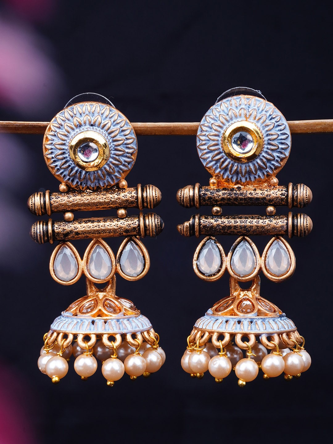 

Urmika Gold-Toned & Grey Enamelled Dome Shaped Jhumkas Earrings