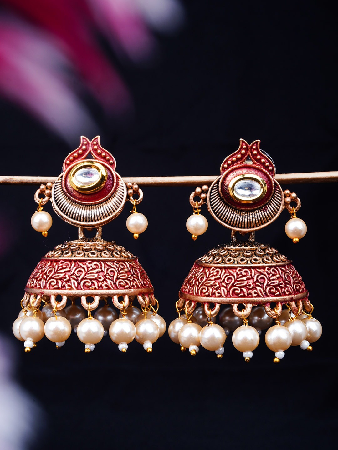 

Urmika Gold-Toned & Fuchsia Enamelled Dome Shaped Jhumkas Earrings