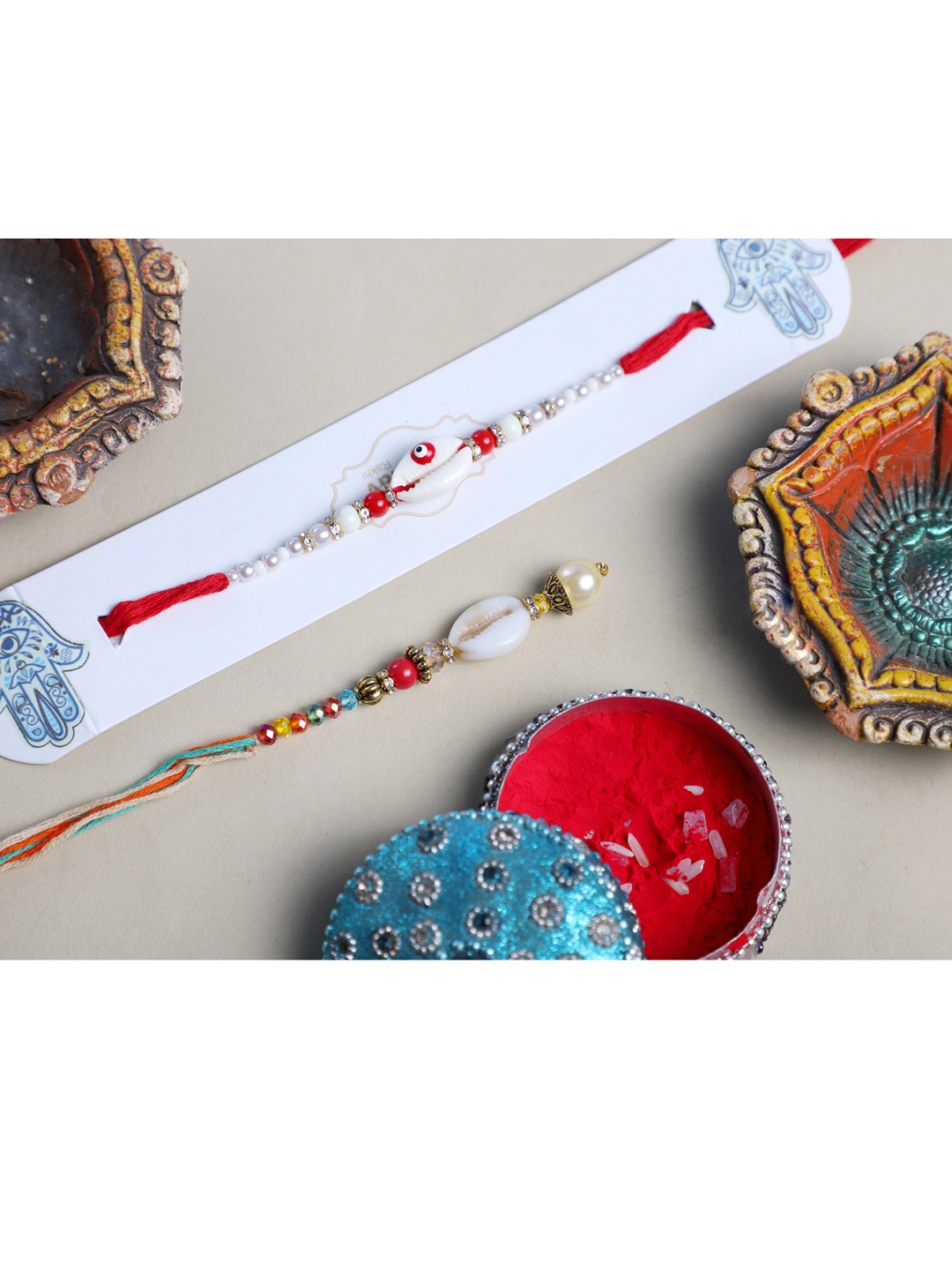

ANIKAS CREATION Set of 2 Red & White Kuadi And Pearl Bhaiya Bhabhi Rakhi