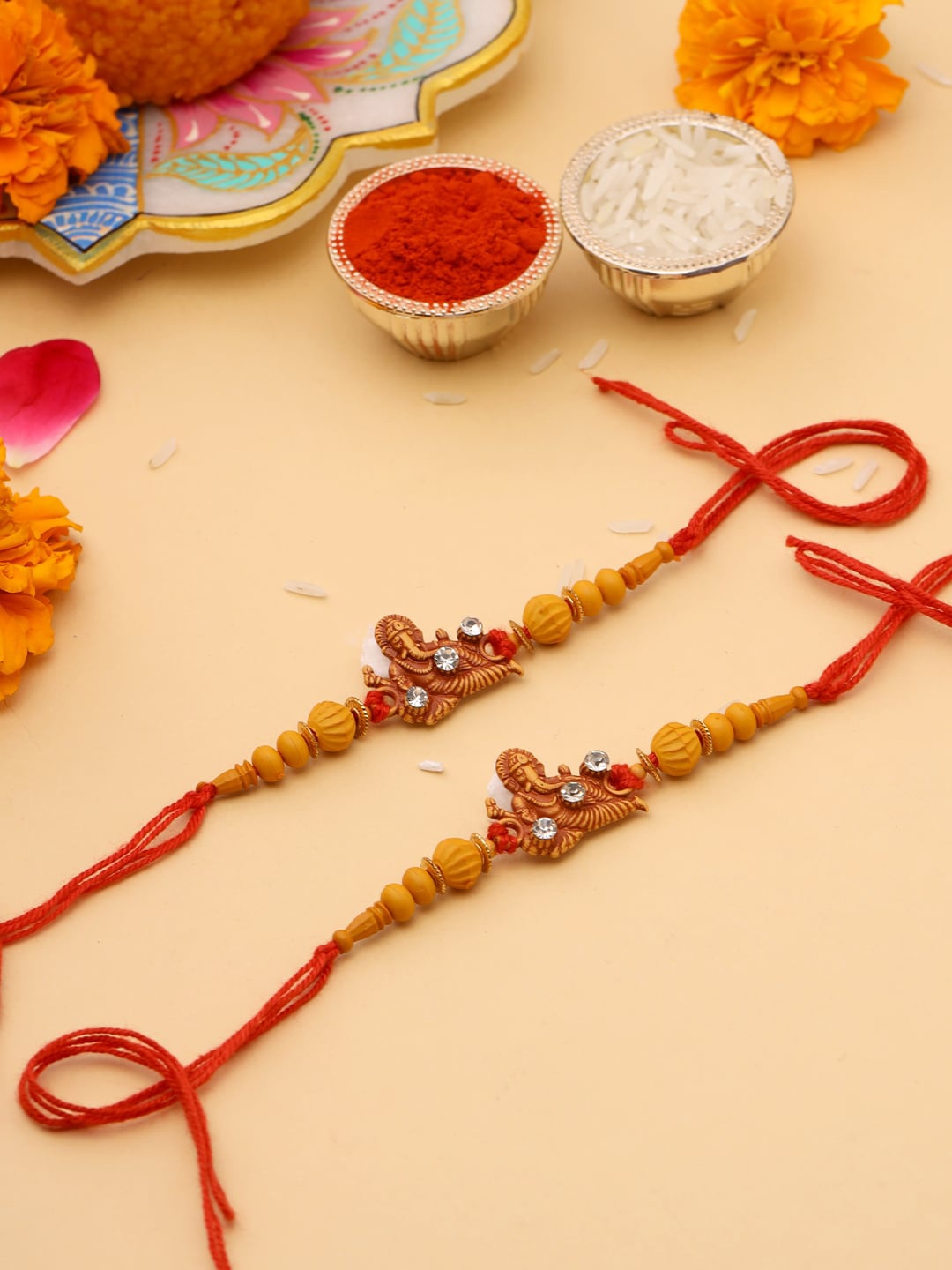 

Natures Buggy Men Set of 2 Yellow & Red Ganesha Idol Rakhi