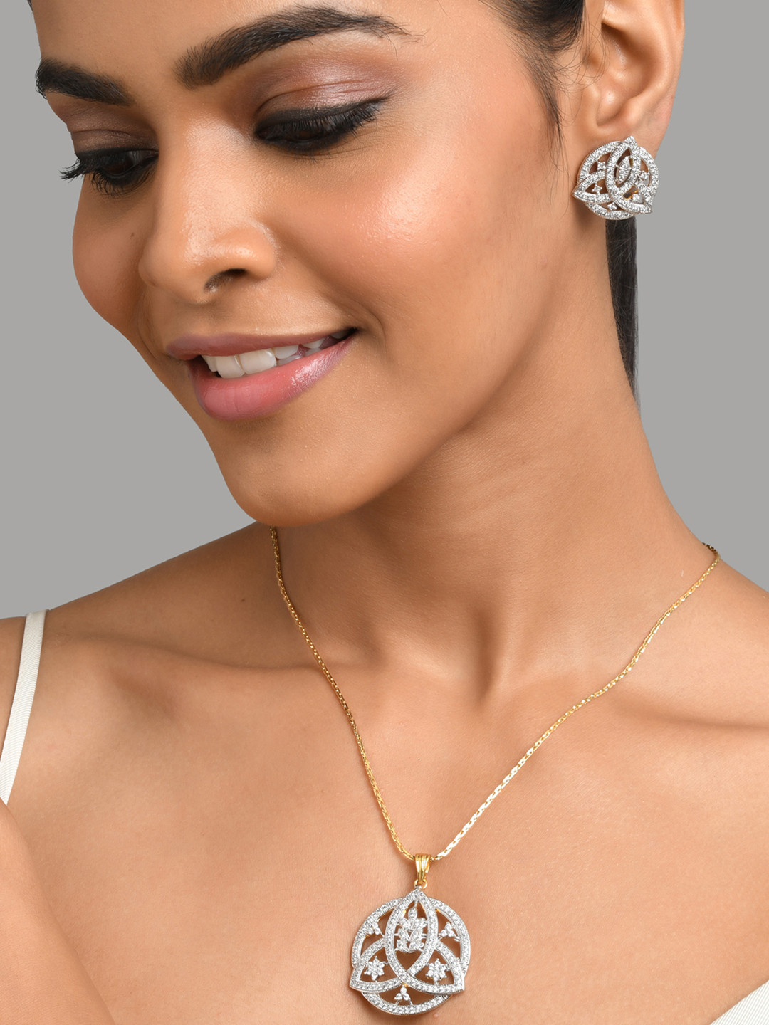 

Fida Gold Plated White AD Studded Handcrafted Pendant Jewellery Set