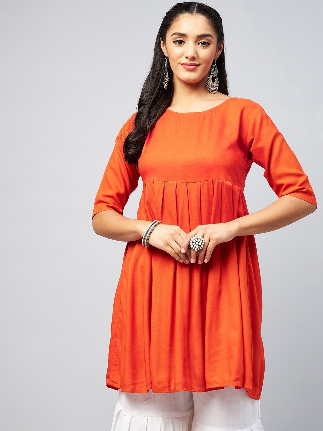 

InWeave Women Orange Solid Short Pleated Anarkali Kurta