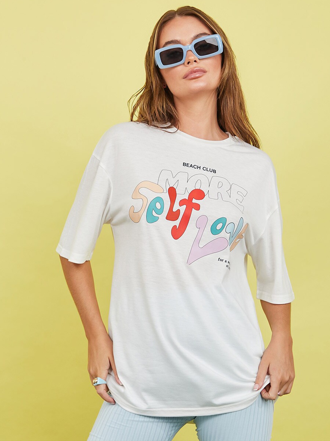 

Styli Women White Self Love Slogan Print Short Sleeves Oversized Longline T-shirt