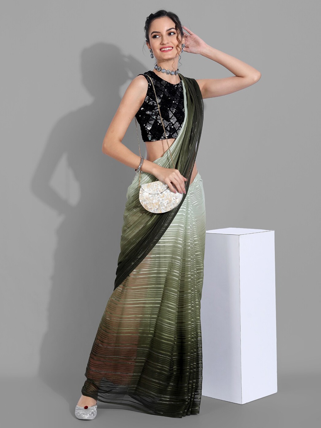 

Mitera Green & Olive Green Striped Zari Arani Saree